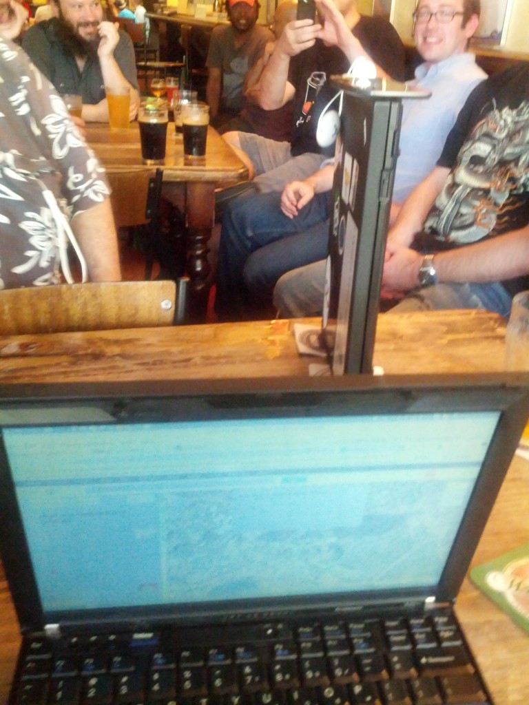 First beer casualty from the conference - laptop being stood vertically to drain, whilst charging a cellphone.